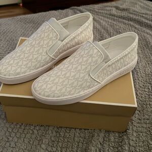 Brand new Michael Kors slip on sneakers
